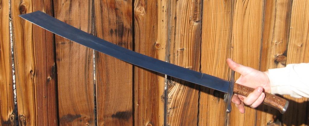 The messer itself, in-hand.  25&quot; blade, 6.5&quot; handle.  The blade is 1060 steel, soft-tempered, the handle is big-leaf maple burl.