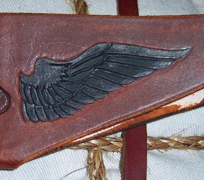 Wing at the tip of the sheath.
